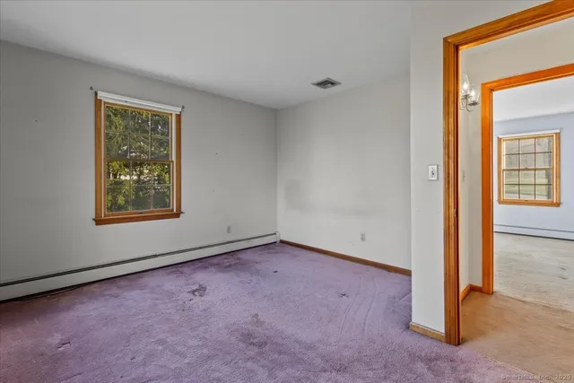 an empty room with windows