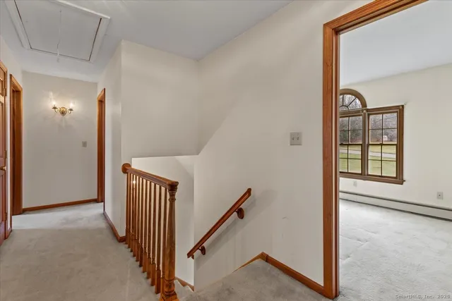 a view of a hallway with windows