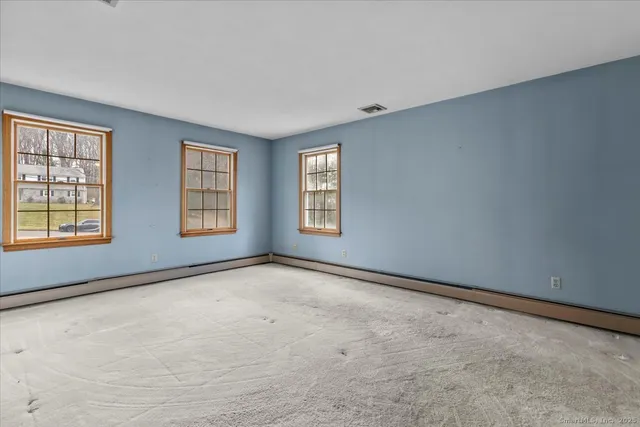an empty room with windows