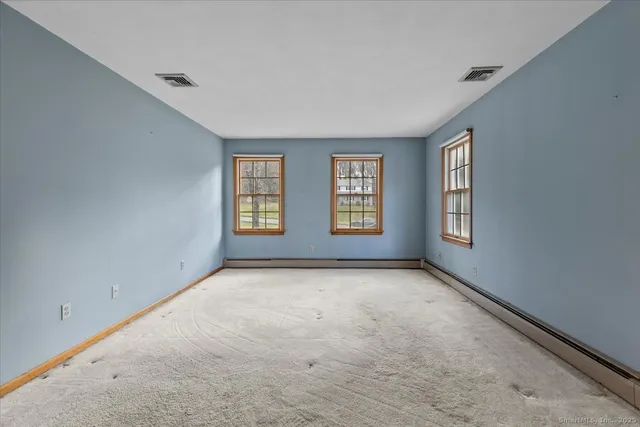 an empty room with windows