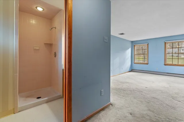 a view of an empty room with a window