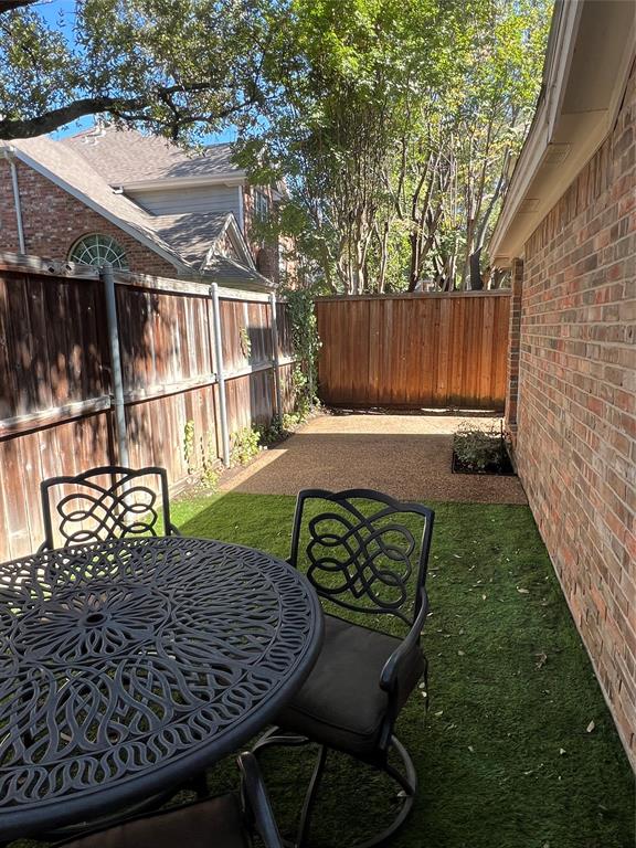 14604 Hemingway Court Addison, TX 75001 - Photo 20 of 27 a backyard of a house with table and chairs