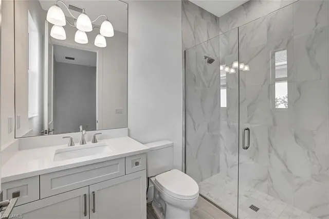 a kitchen with a table and chairs in it