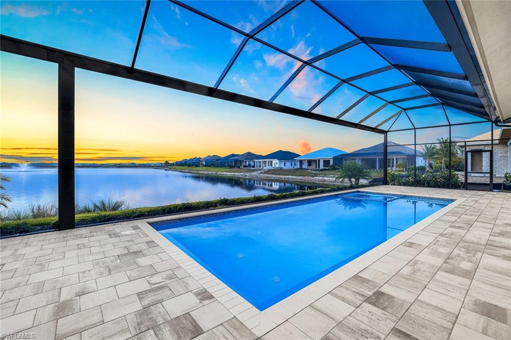9506 Caymas Way Naples, FL 34114 - Photo 31 of 50 a view of swimming pool with outdoor seating
