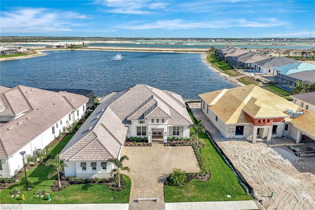 9506 Caymas Way Naples, FL 34114 - Photo 45 of 50 an aerial view of residential houses with outdoor space and ocean