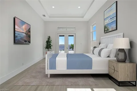 a bedroom with a bed and glass wall