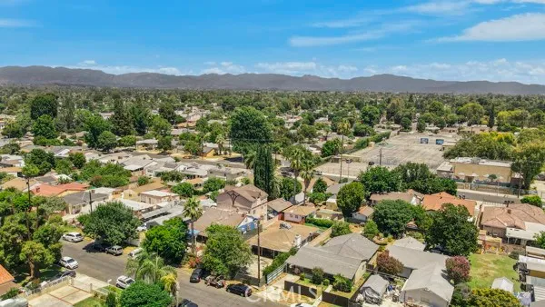 an aerial view of a house with a yard basket ball court and outdoor seating