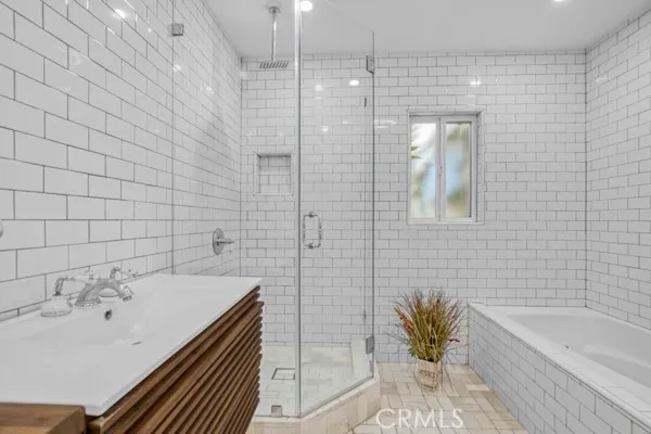 a bathroom with a bathtub and a sink