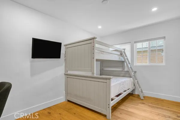 a room with bed and a flat screen tv