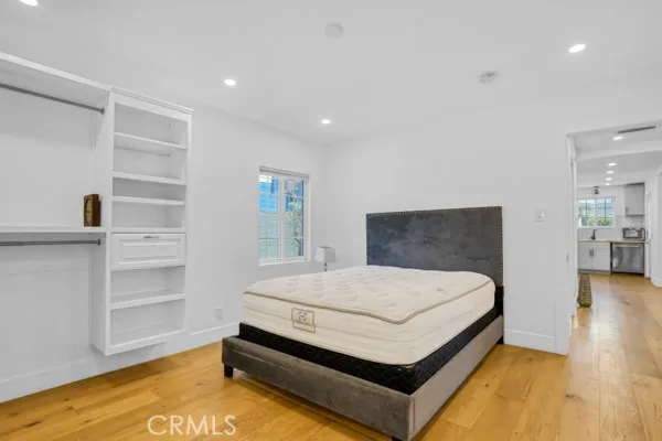 a bed room with a bed and dresser