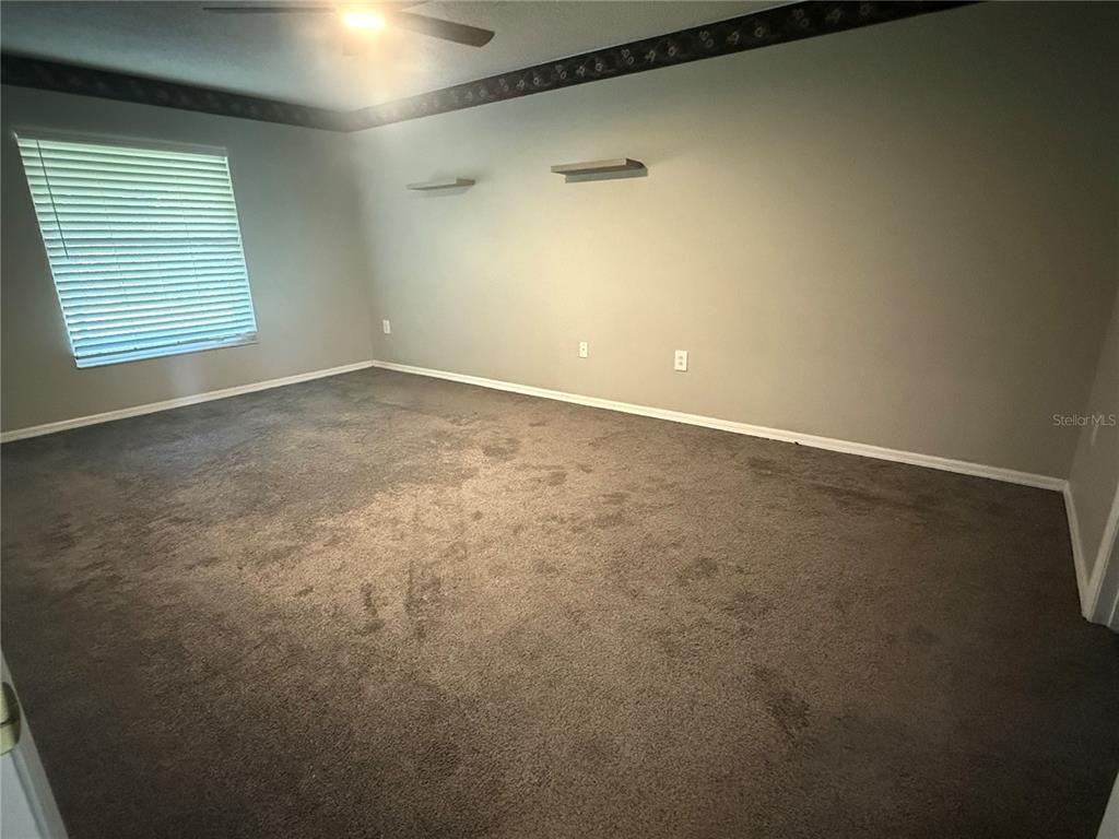 19509 Sheldon Street Orlando, FL 32833 - Photo 30 of 46 an empty room with windows