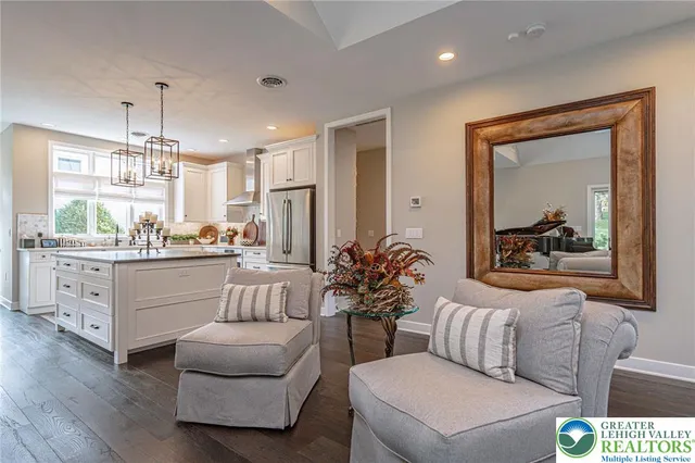 a kitchen with stainless steel appliances a sink a stove and cabinets