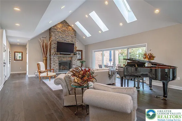a kitchen with appliances cabinets and a large window
