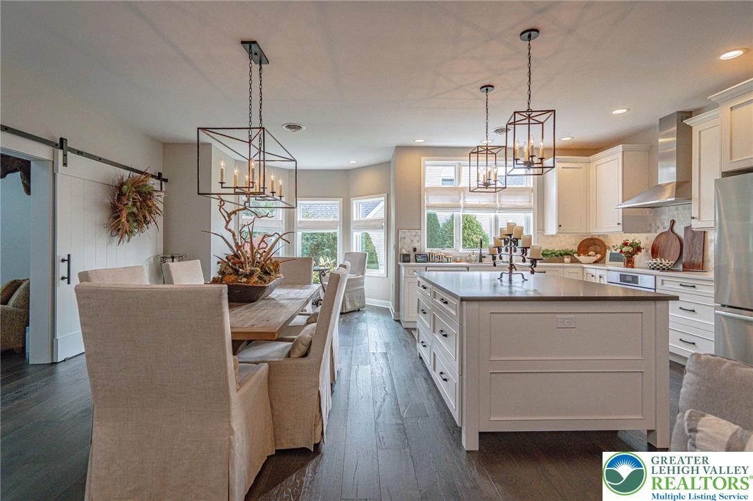 2560 Gracie Lone Lower Macungie Township, PA 18062 - Photo 18 of 68 a living room with kitchen island granite countertop furniture a chandelier a sink and a window