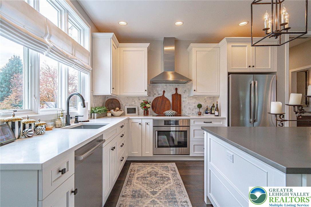 2560 Gracie Lone Lower Macungie Township, PA 18062 - Photo 23 of 68 a large kitchen with stainless steel appliances a sink a stove and a refrigerator