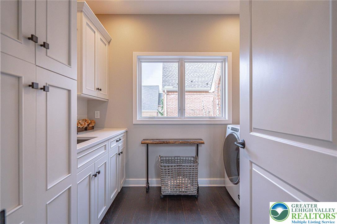 2560 Gracie Lone Lower Macungie Township, PA 18062 - Photo 34 of 68 a kitchen with granite countertop white cabinets and white appliances