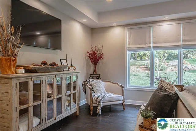 a bathroom with a sink a mirror and a shower