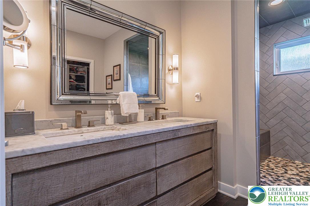 2560 Gracie Lone Lower Macungie Township, PA 18062 - Photo 47 of 68 a bathroom with a sink a vanity and a mirror