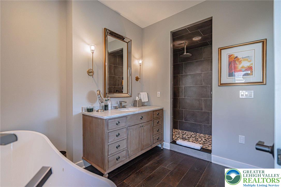 2560 Gracie Lone Lower Macungie Township, PA 18062 - Photo 55 of 68 a bathroom with a sink a mirror and a shower