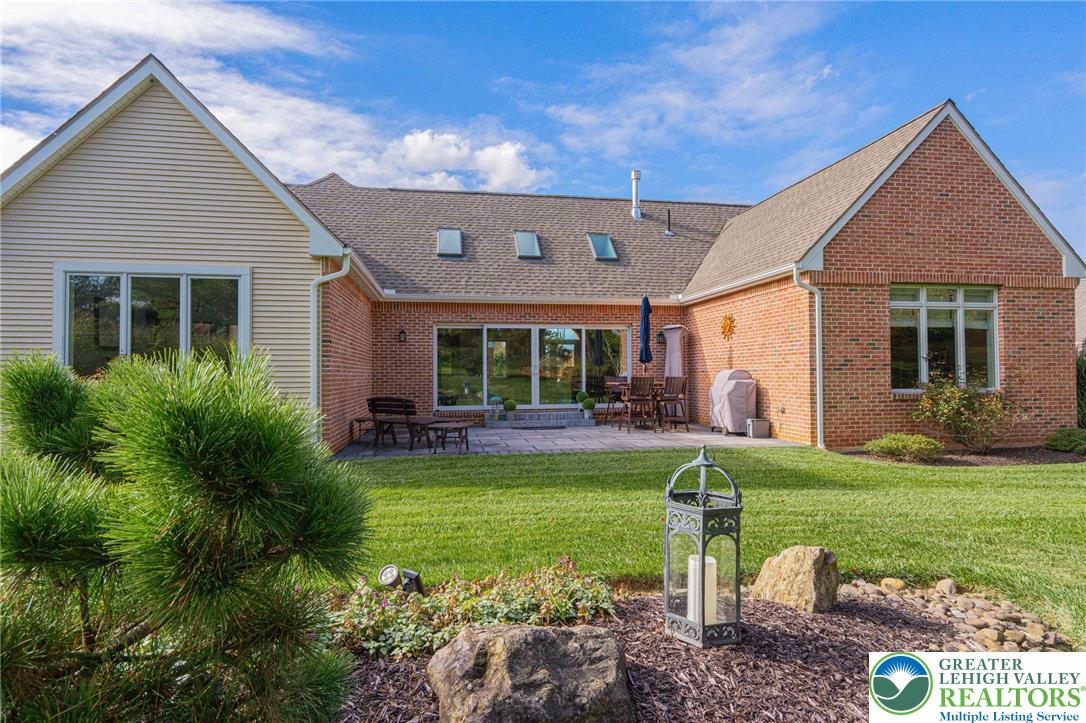 2560 Gracie Lone Lower Macungie Township, PA 18062 - Photo 65 of 68 a view of a house with backyard sitting area and swimming pool