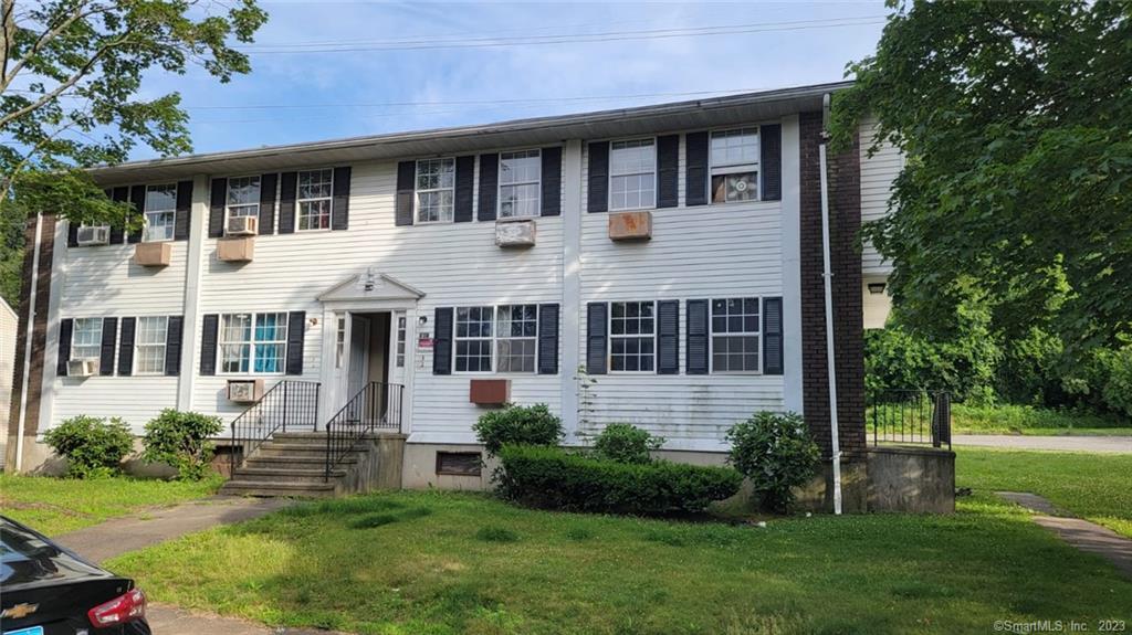 81 Angel Drive, Unit B Waterbury, CT 06708 - Photo 1 of 1 a front view of a house with a yard and porch