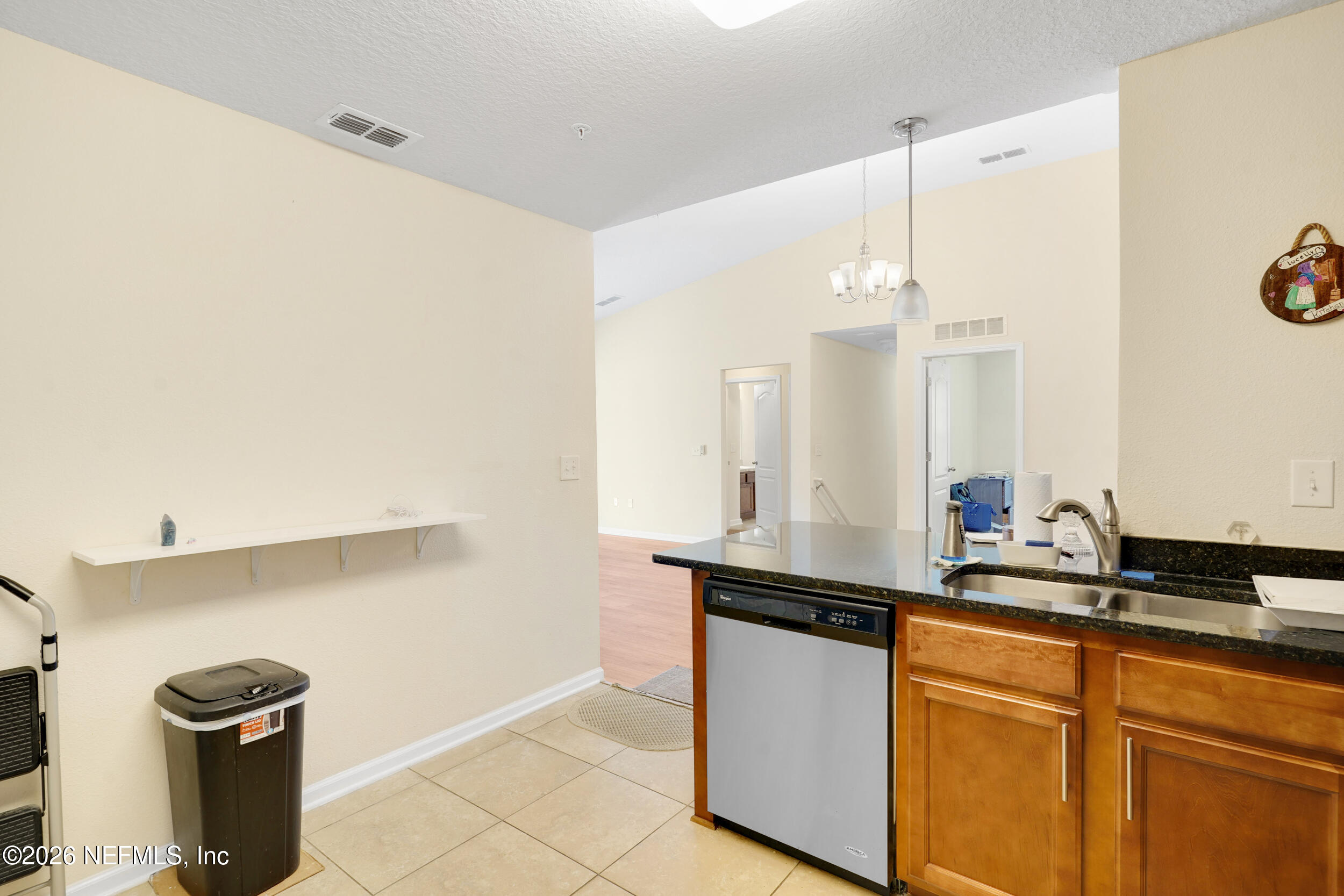 1424 Golden Lake Loop St. Augustine, FL 32084 - Photo 20 of 40 a kitchen with a sink and a refrigerator