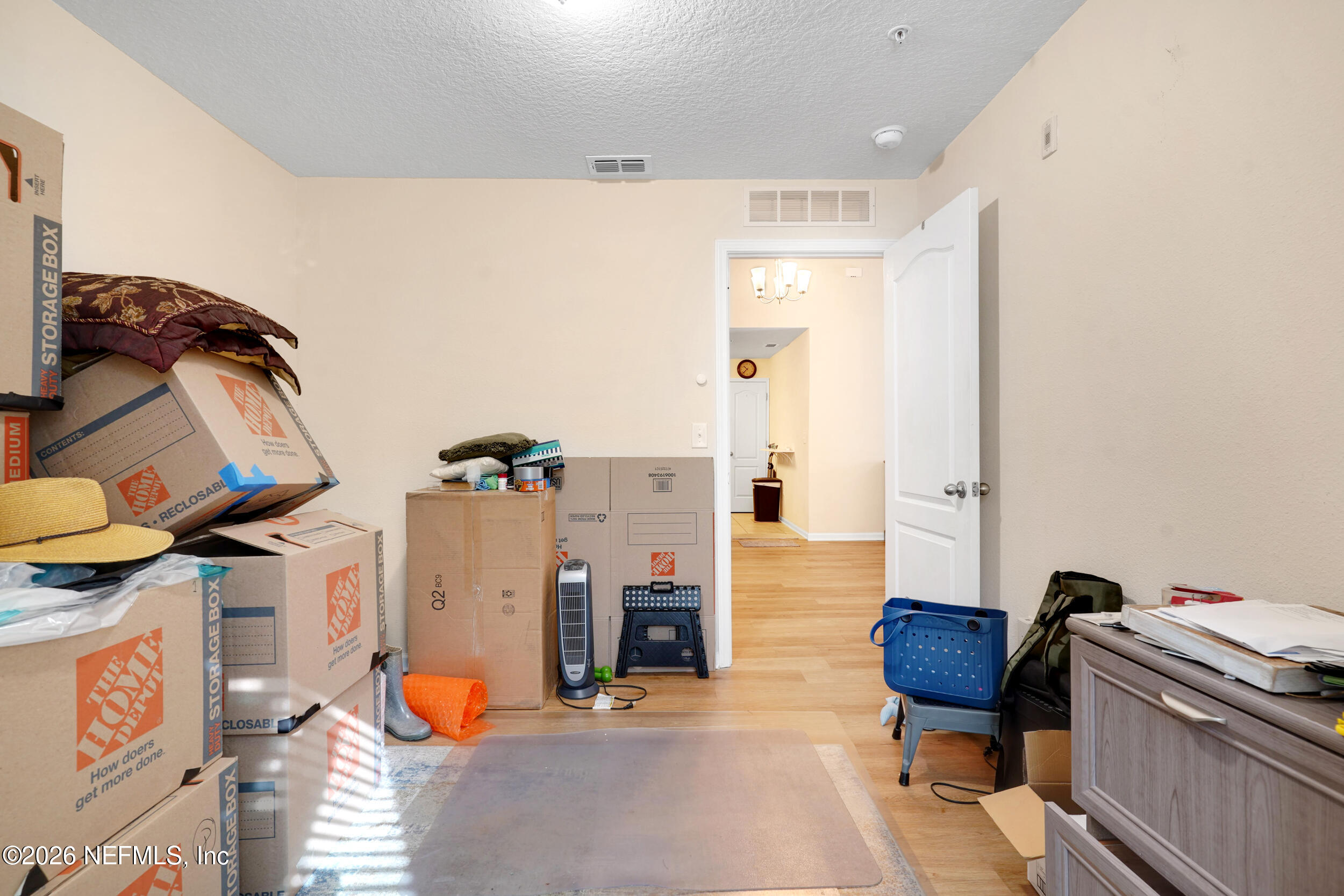 1424 Golden Lake Loop St. Augustine, FL 32084 - Photo 27 of 40 a view of a workspace with furniture and a lamp