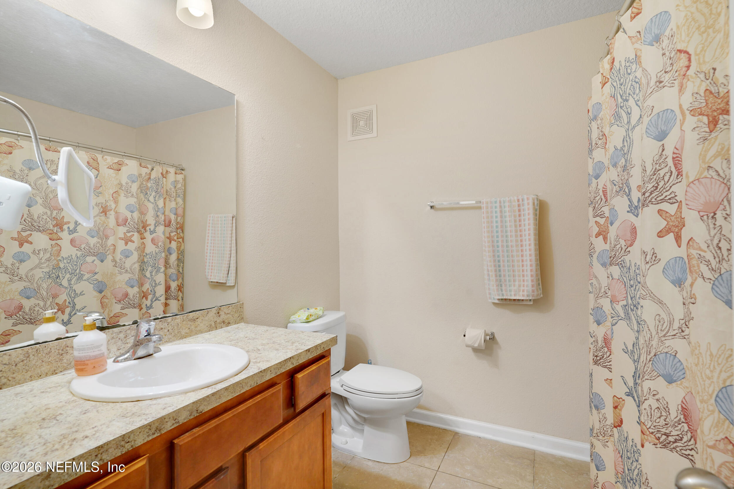 1424 Golden Lake Loop St. Augustine, FL 32084 - Photo 29 of 40 a bathroom with a granite countertop sink toilet and shower