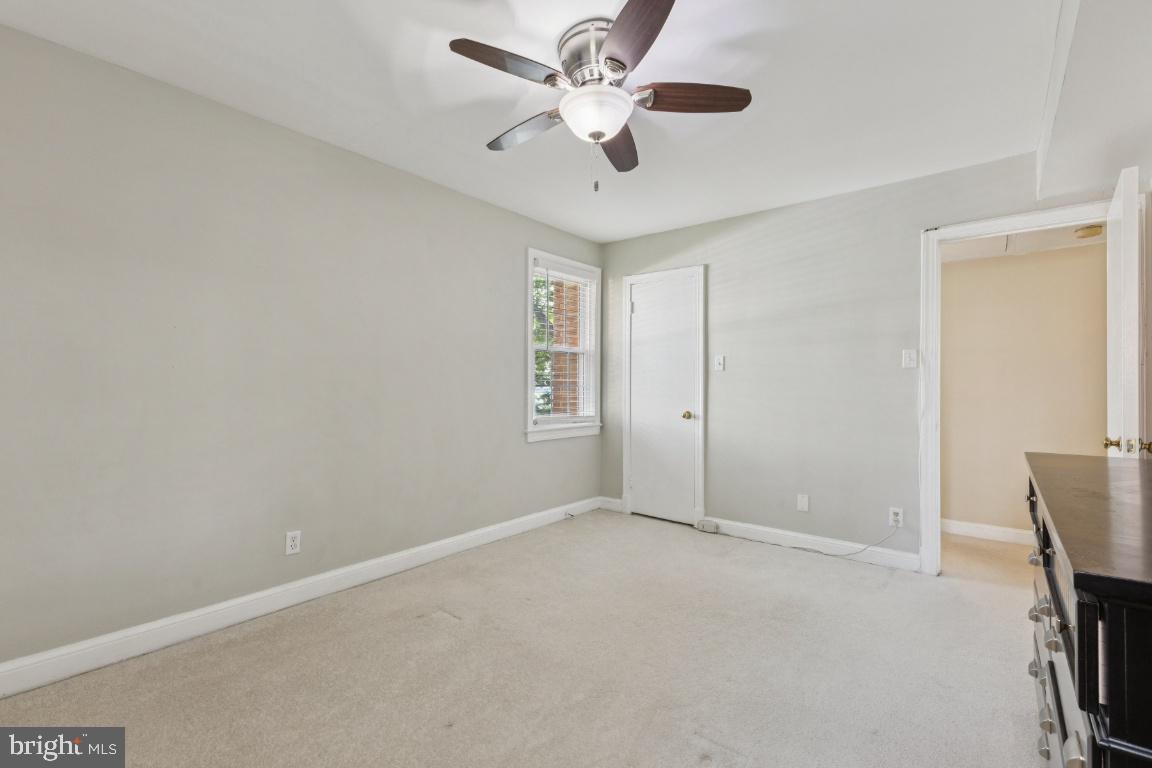 2803 Arlington Boulevard, Unit 101 Arlington, VA 22201 - Photo 11 of 12 an empty room with windows and fan