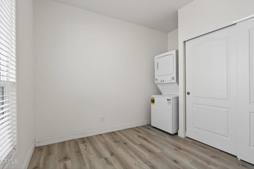 3975 Telegraph Road, Unit 2 Ventura, CA 93003 - Photo 11 of 21 wooden floor in an empty room with a window