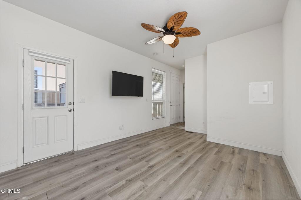 3975 Telegraph Road, Unit 2 Ventura, CA 93003 - Photo 5 of 21 wooden floor in an empty room with a window