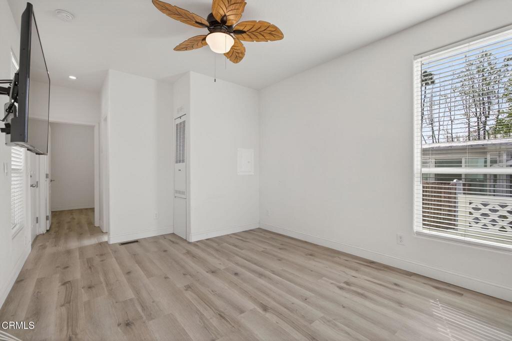 3975 Telegraph Road, Unit 2 Ventura, CA 93003 - Photo 6 of 21 wooden floor in an empty room with a window