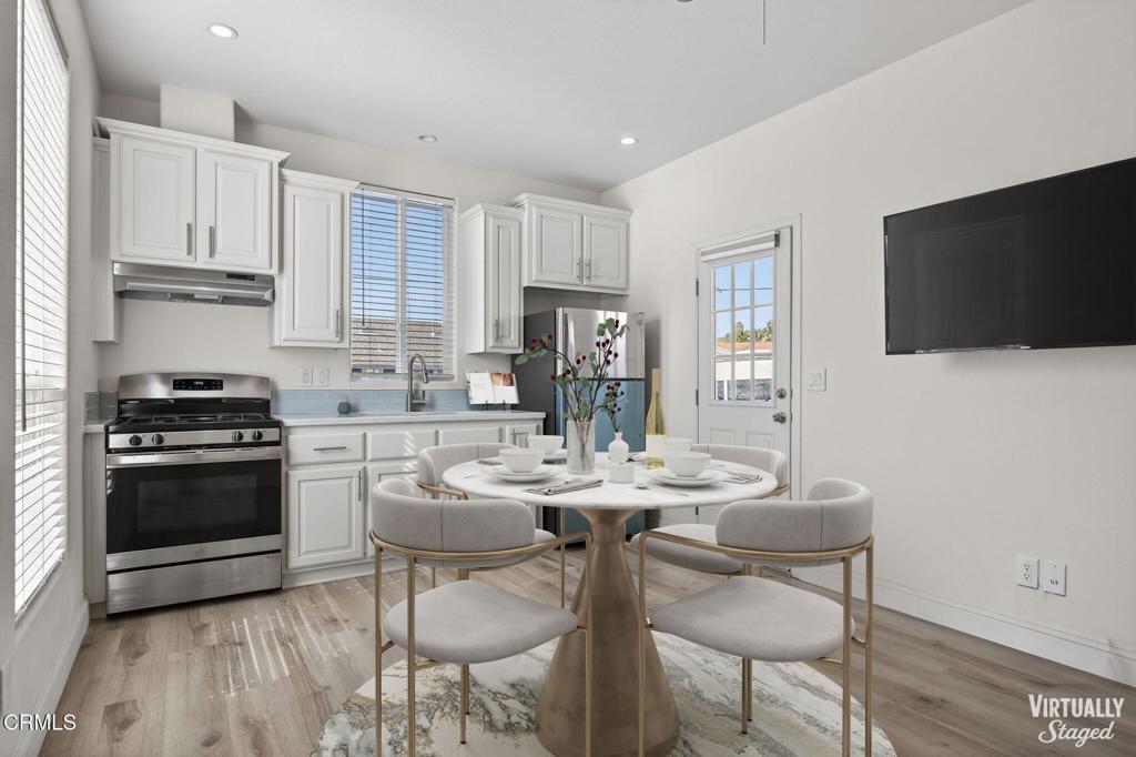 3975 Telegraph Road, Unit 2 Ventura, CA 93003 - Photo 8 of 21 a kitchen with stainless steel appliances a stove a sink a microwave and a refrigerator