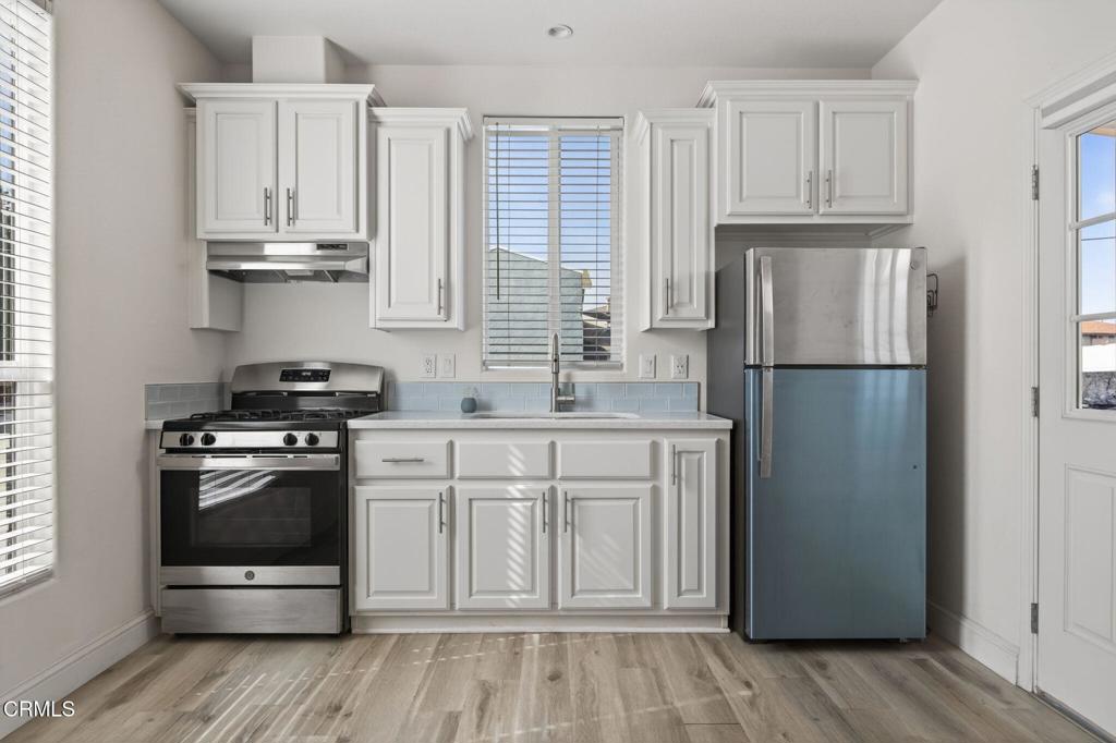 3975 Telegraph Road, Unit 2 Ventura, CA 93003 - Photo 9 of 21 a kitchen with stainless steel appliances granite countertop a refrigerator and a stove