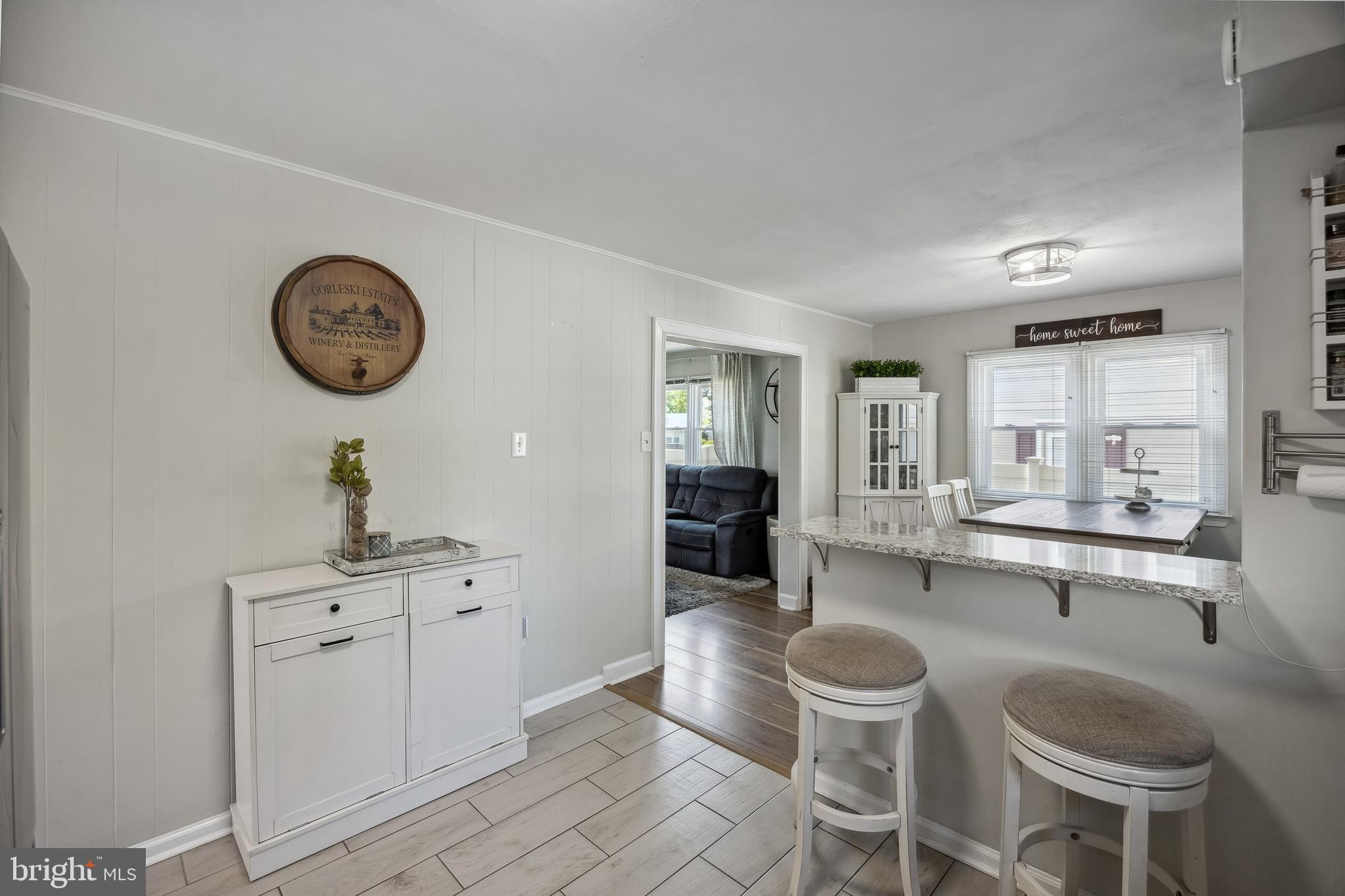 805 Delaware Avenue Riverside, NJ 08075 - Photo 12 of 42 a dining hall with granite countertop a stove a sink and a clock
