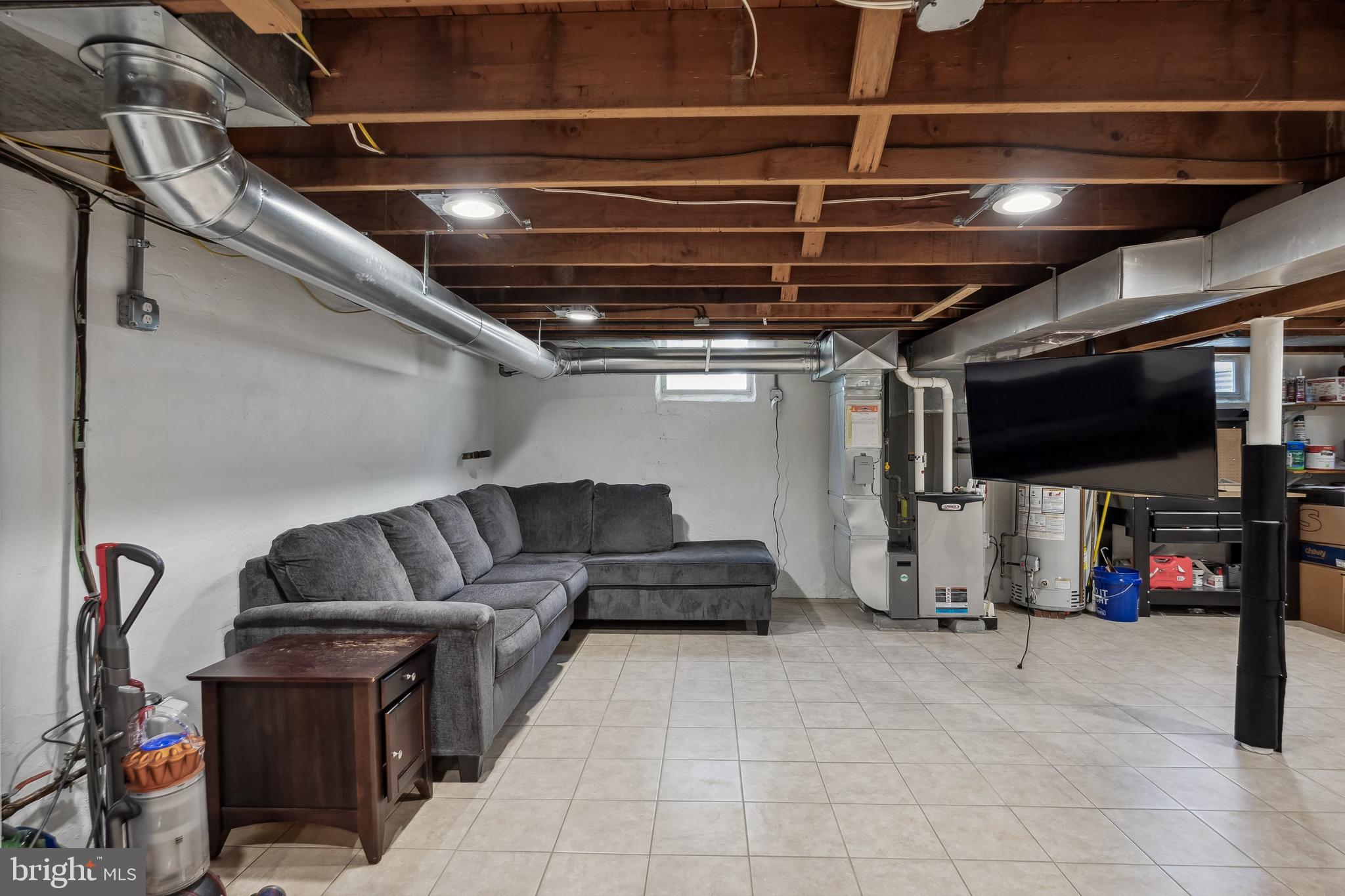 805 Delaware Avenue Riverside, NJ 08075 - Photo 20 of 42 a living room with furniture and a flat screen tv
