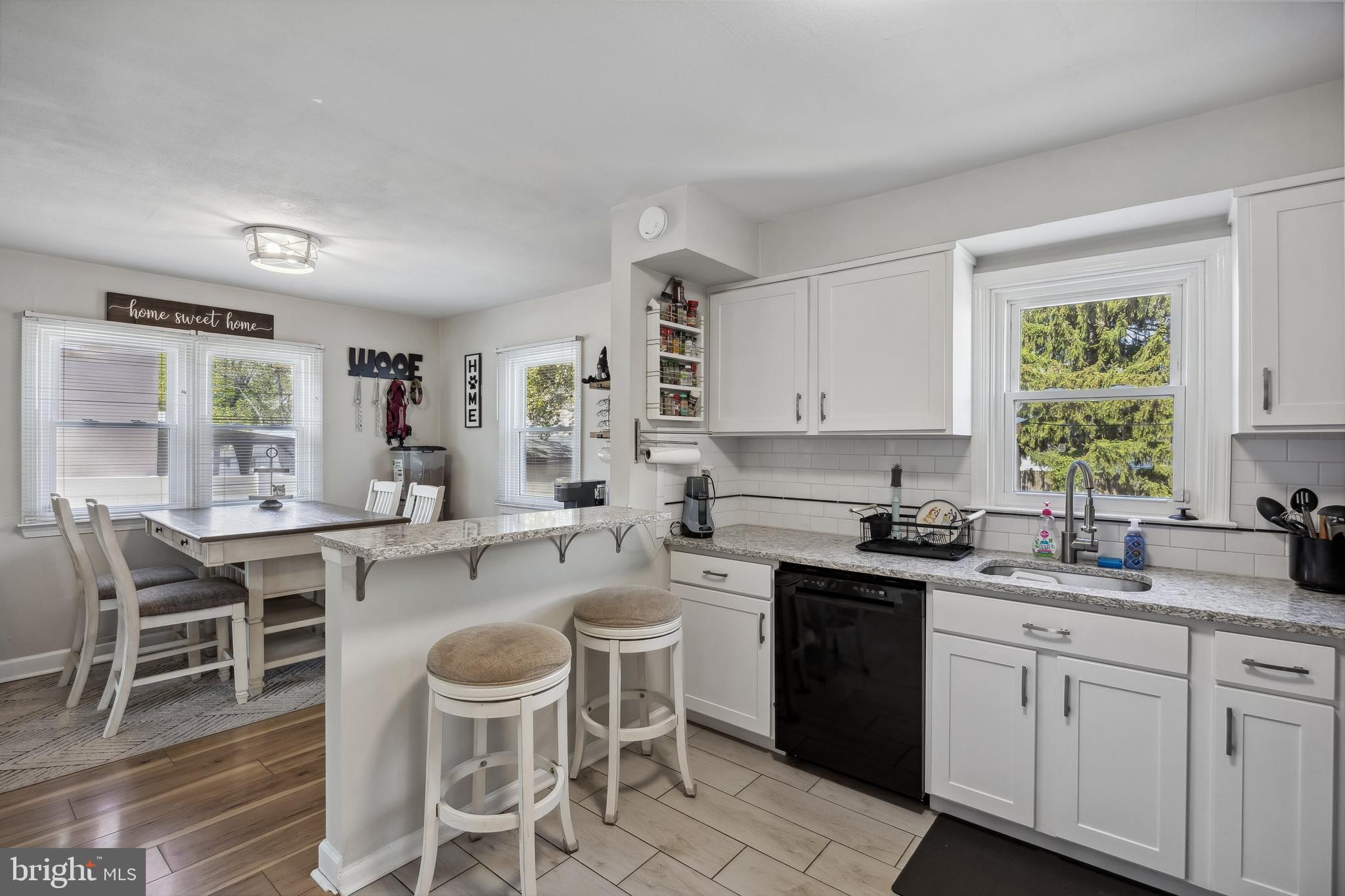 805 Delaware Avenue Riverside, NJ 08075 - Photo 9 of 42 a kitchen with a sink stove and cabinets