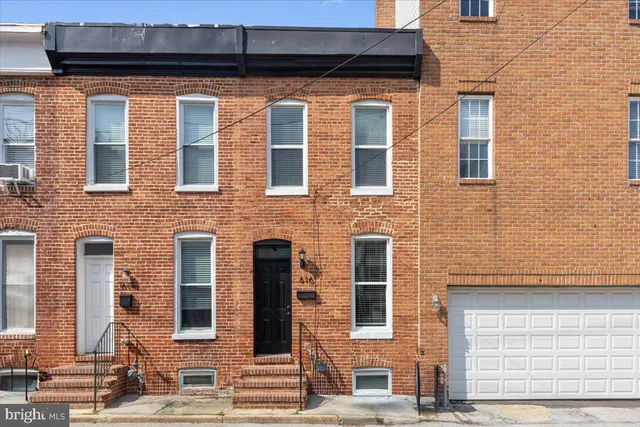a front view of a building with a street