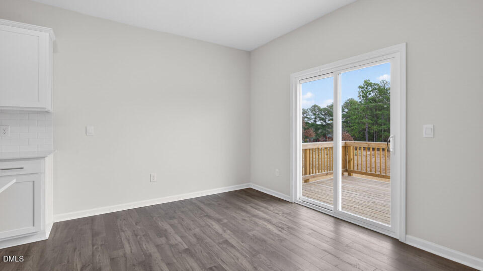 138 Fair Child Road Spring Lake, NC 28390 - Photo 13 of 45 an empty room with wooden floor and windows