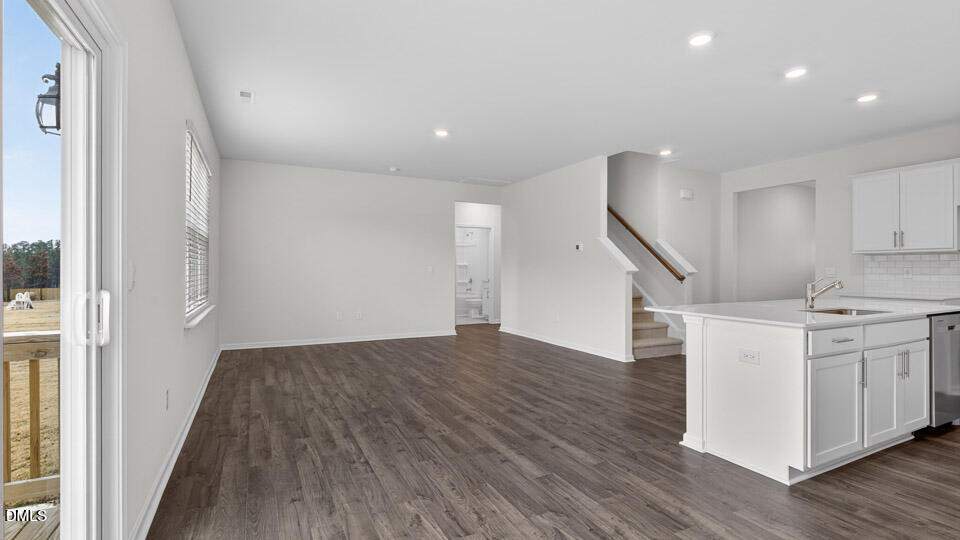 138 Fair Child Road Spring Lake, NC 28390 - Photo 14 of 45 a view of a kitchen with wooden floor and electronic appliances