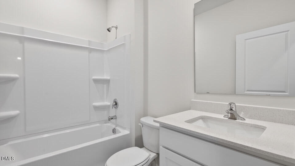 138 Fair Child Road Spring Lake, NC 28390 - Photo 33 of 45 a bathroom with a granite countertop sink toilet and shower