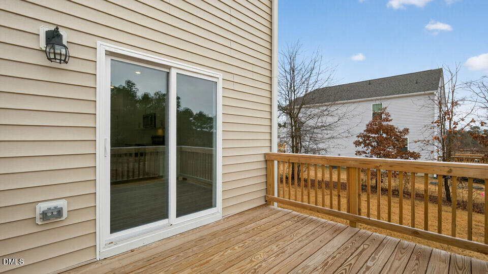 138 Fair Child Road Spring Lake, NC 28390 - Photo 41 of 45 a view of a balcony with wooden floor and fence