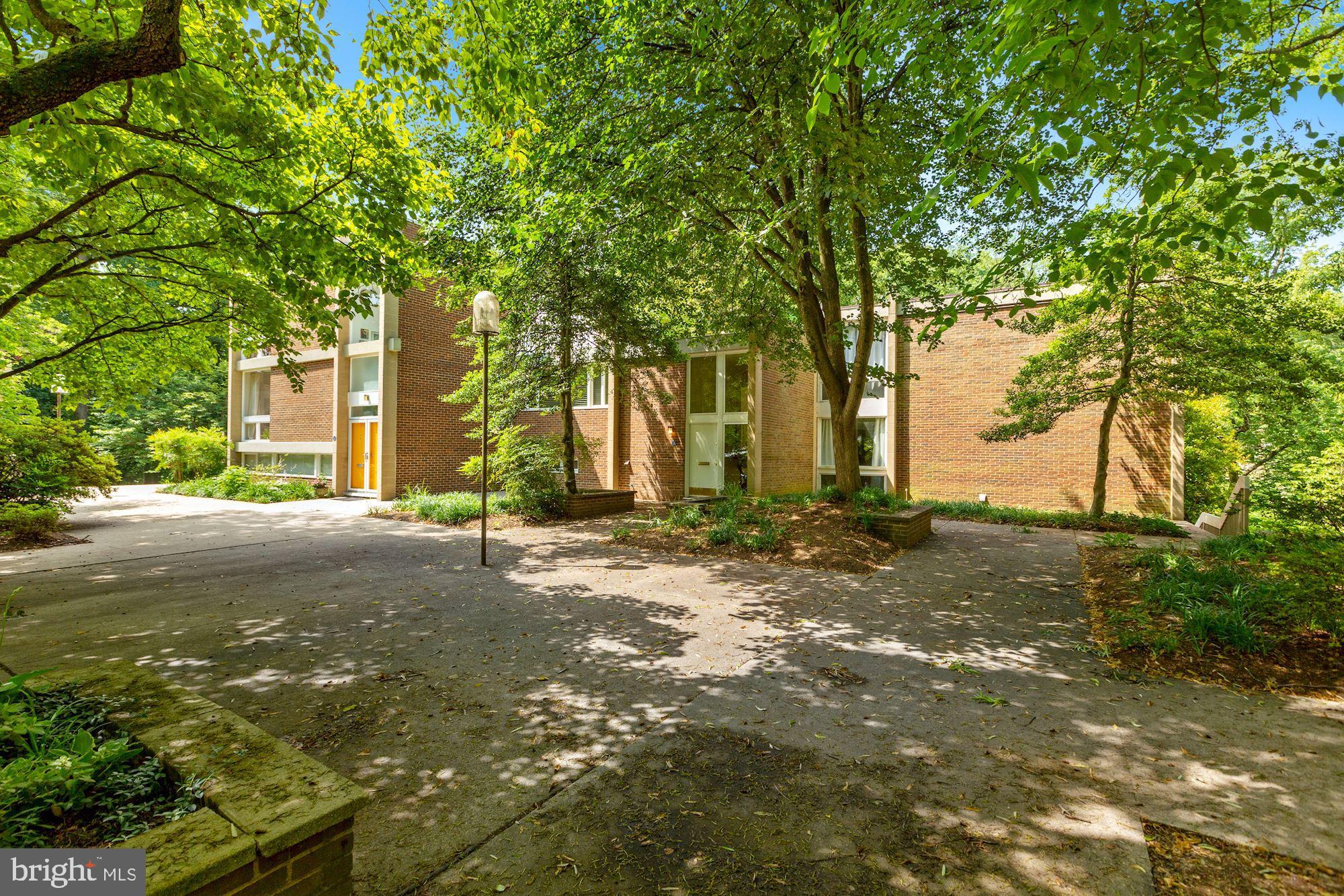11515 Maple Ridge Road Reston, VA 20190 - Photo 3 of 39 Brick exterior with white trim, easy to maintain