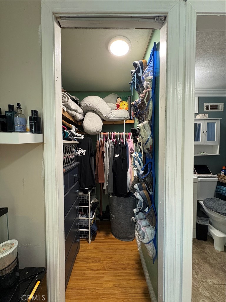 23500 The Old Road, Unit 37 Newhall, CA 91321 - Photo 10 of 22 a view of a hallway with workspace and living room