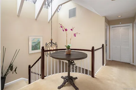 a view of hall way with furniture