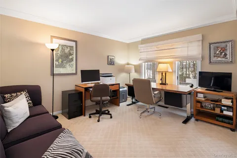 a view of a livingroom with workspace and a couch