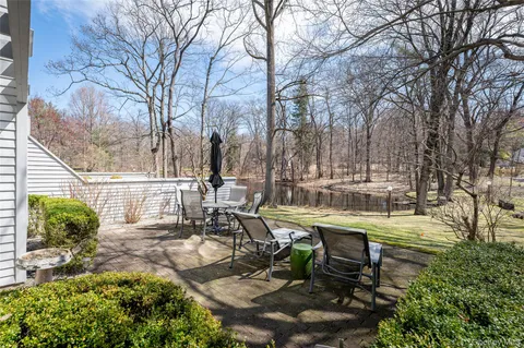 a view of a swimming pool and lounge chairs