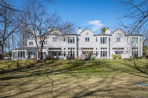 a front view of residential houses with buildings