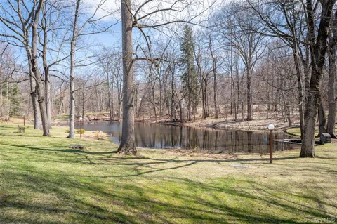 a swimming pool with wooden fence