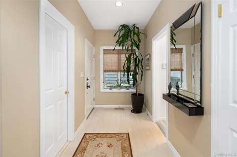a view of a bathroom with a tub and windows